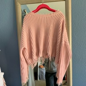 Distressed light pink cropped back sweater
